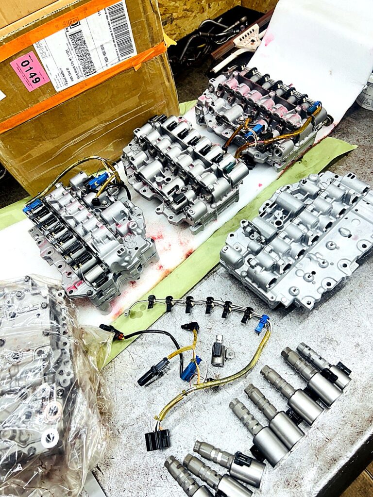 Remanufactured valve bodies with solenoids and wiring harnesses laid out at Tri-Star Transmissions